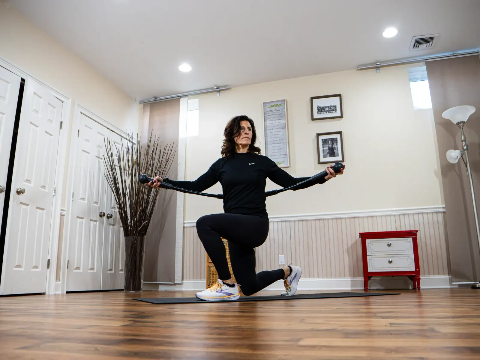 Woman performing oscillating BendyBar exercise
